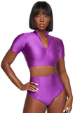 Top corto morado de manga corta con cremallera