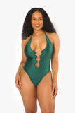 a woman in a hunter green one piece bodysuit