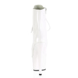 Botas de charol blanco con punta cerrada y tacón